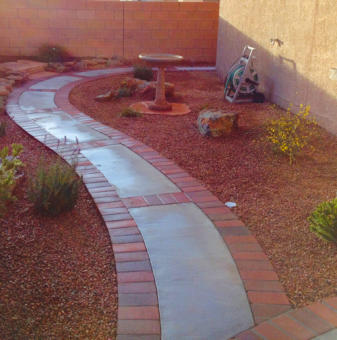 Cement walkway with brick paver edging by Mountain Paradise Landscaping, Rio Rancho & Albuquerque, New Mexico