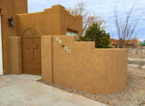 Block wall with stucco in a front yard by Mountain Paradise Landscaping, Rio Rancho & Albuquerque, New Mexico