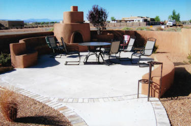 Patio with walkway, benches, and kiva fireplace by Mountain Paradise Landscaping, Rio Rancho & Albuquerque, New Mexico