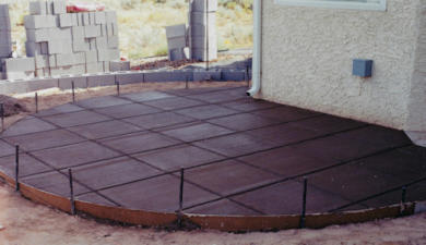 Colored and scored concrete patio design by Mountain Paradise Landscaping, Rio Rancho & Albuquerque, New Mexico