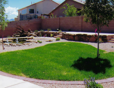Sod installation with a remote moss-rock patio and water feature by Mountain Paradise Landscaping, Rio Rancho & Albuquerque, New Mexico
