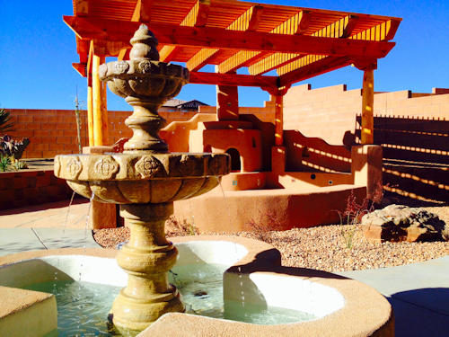 Fountain water feature wtih Kiva Fireplace under pergola by Mountain Paradise Landscaping, Rio Rancho & Albuquerque, New Mexico
